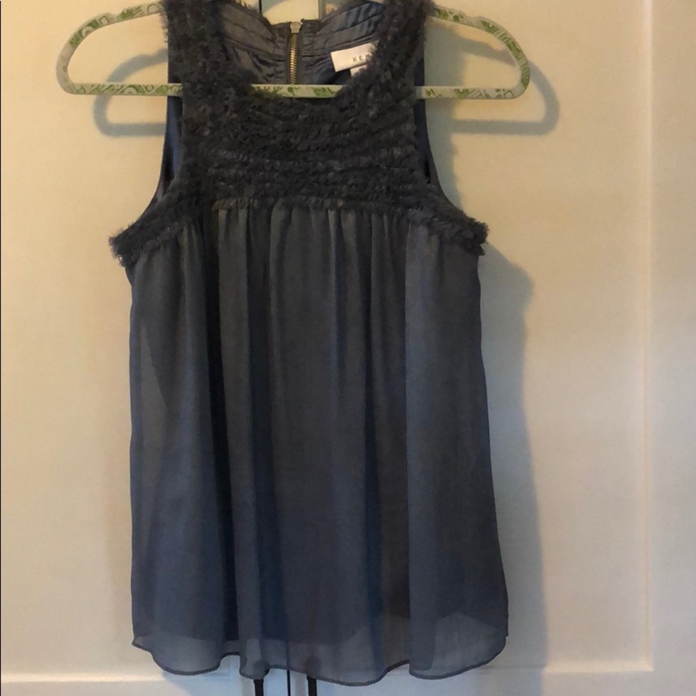 Slightly shimmering and a fluffy neckline